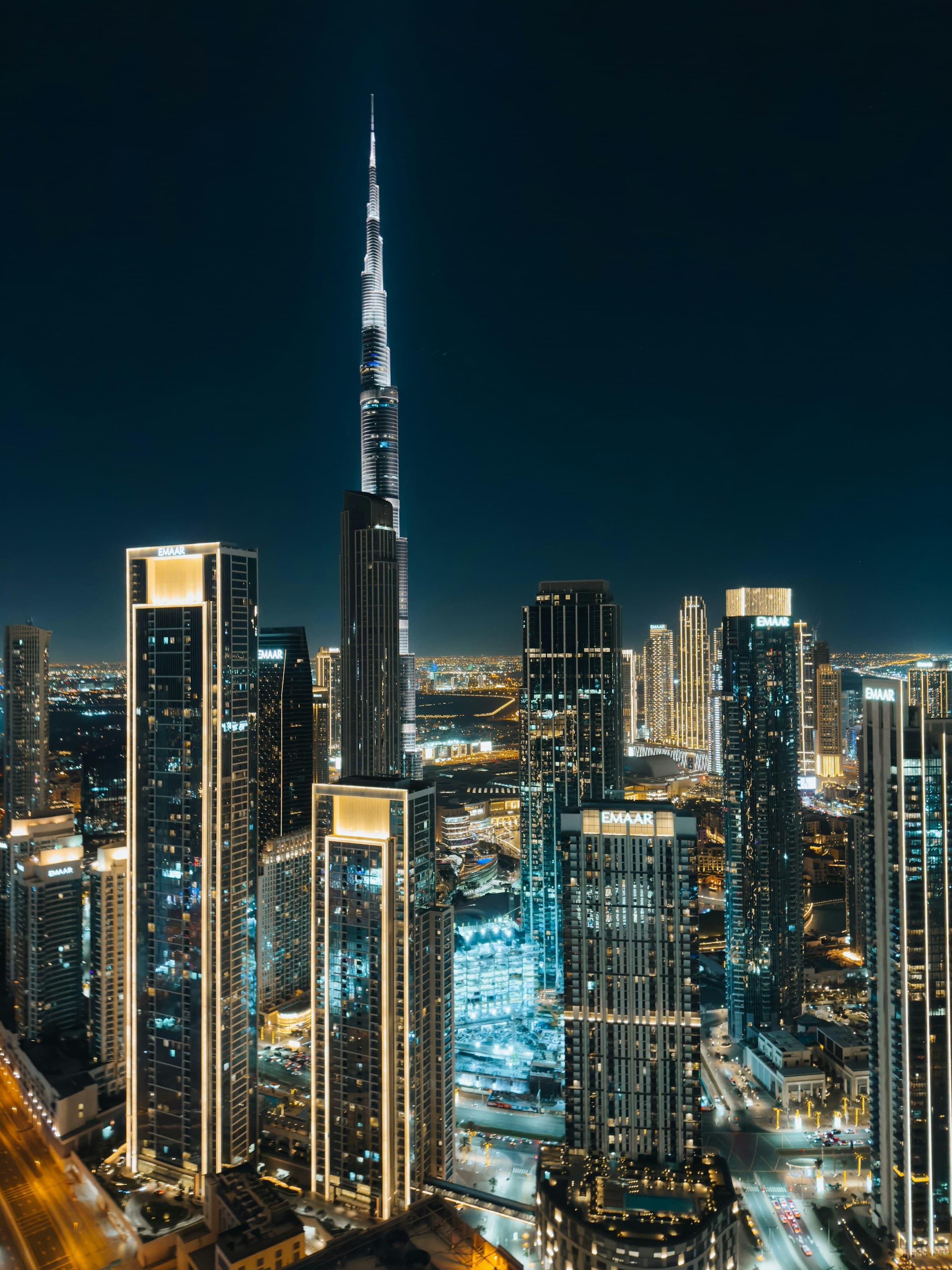 Aerial night view of Dubai city skyline from above